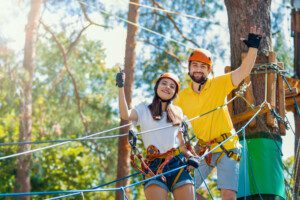 A young woman and man get ready to enjoy a thrilling Smoky Mountain ziplines experience.