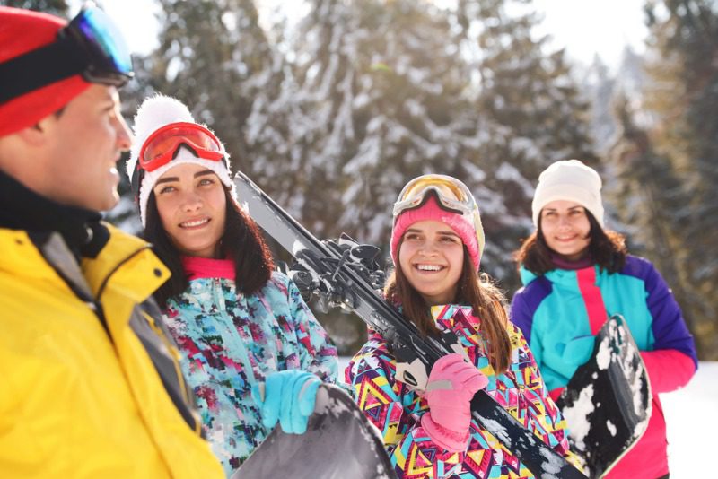 New Hampshire Ski Resorts: A young family enjoys winter fun at a near