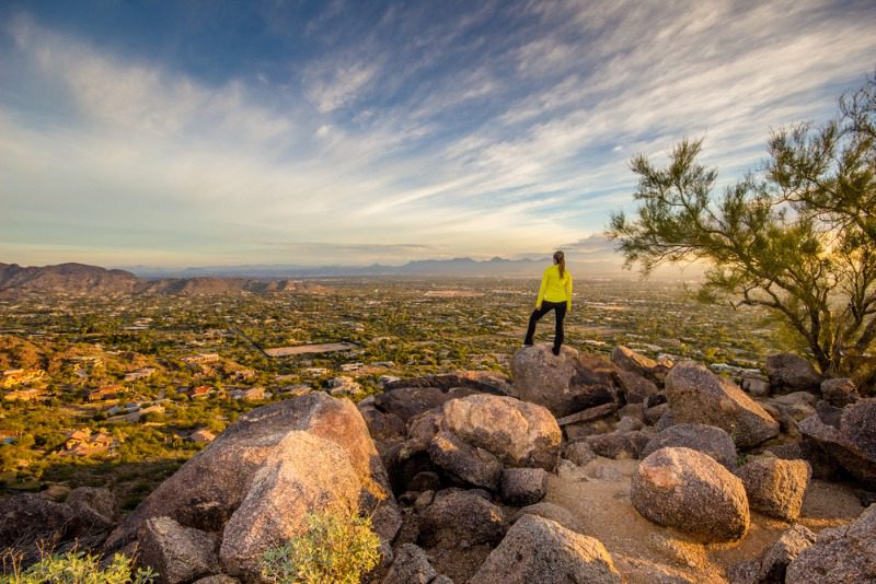 Scottsdale Hiking Trails: A young woman gazes over the desert landscape near Scottsdale, Arizona.